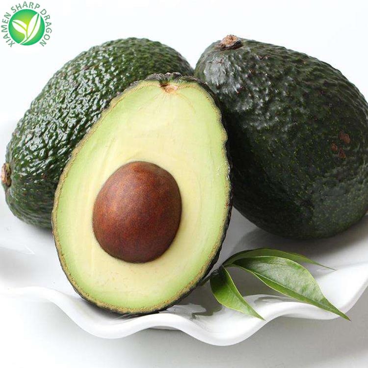 Whole and cut avocados showing the edible flesh, peel and stone