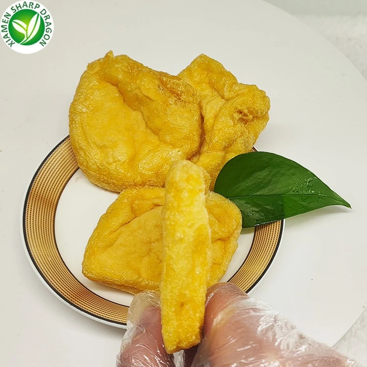 Fried pocket shape and thickness Gloved hand holding a fried tofu pocket beside a plate