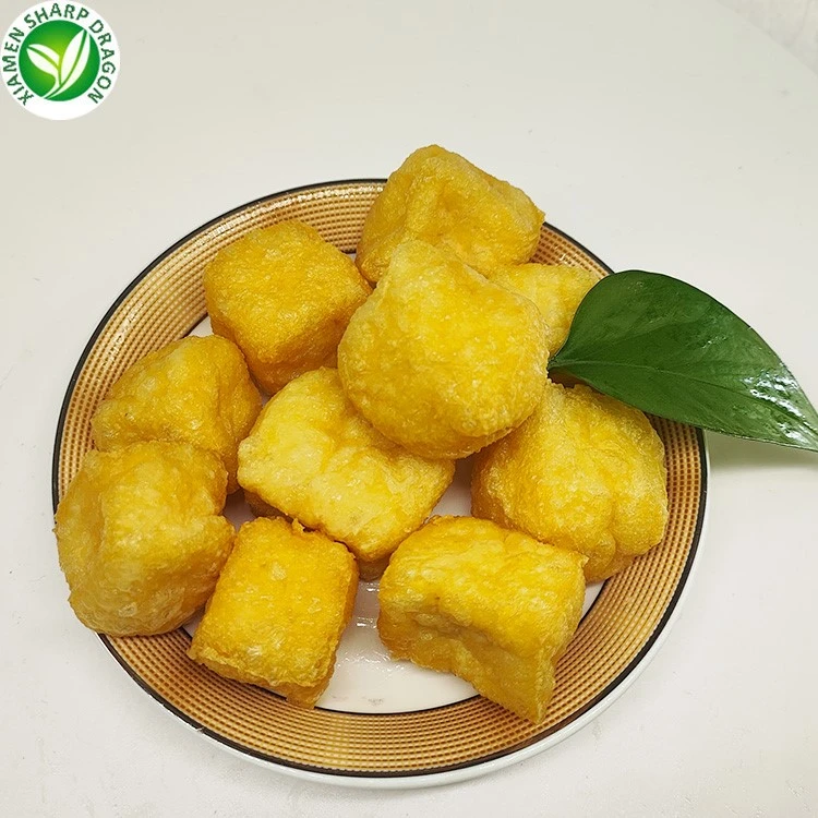 Fried bean curd cubes Golden fried tofu cubes on a white plate
